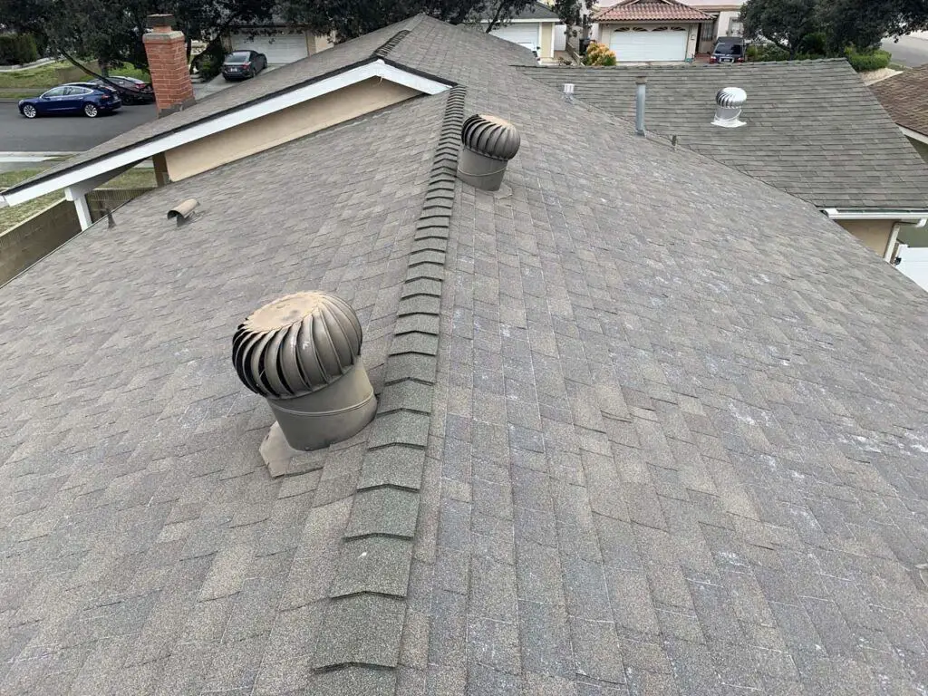 The old shingle roof of our home that was worn down to the fiberglass