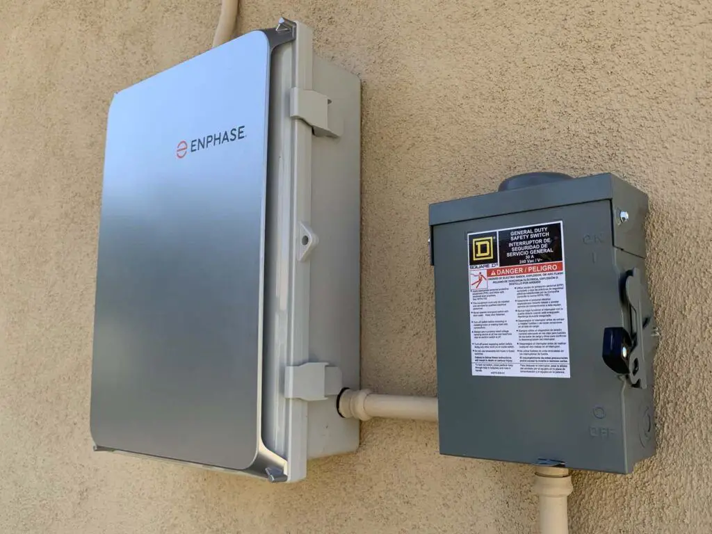 The box on the right is the disconnect box, which trips when the grid has an outage and thereby shuts down the solar pv system