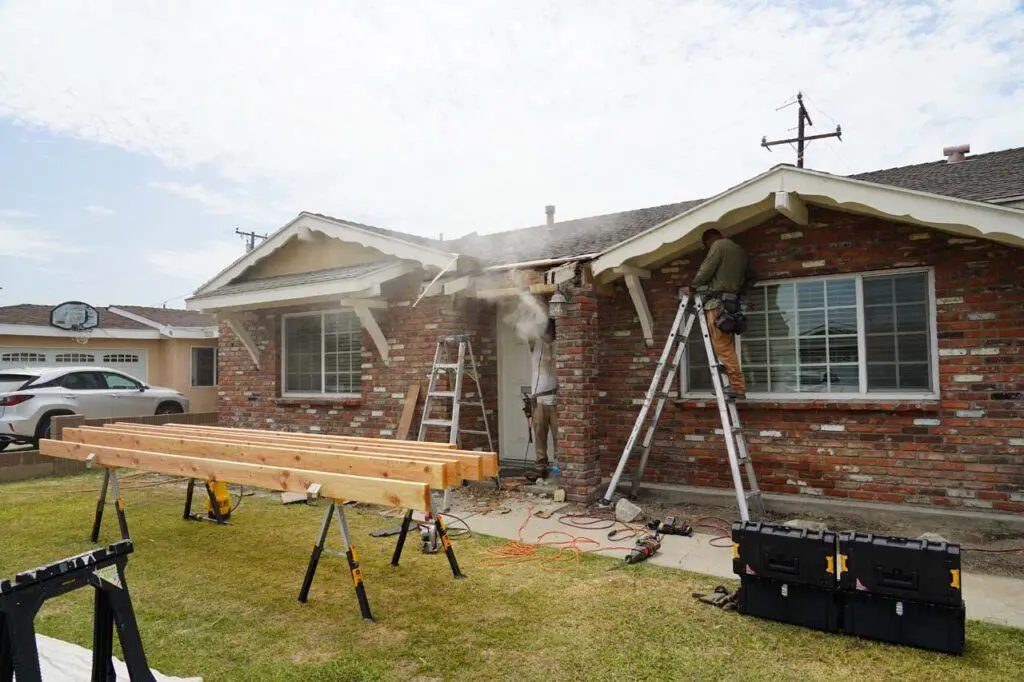 Kenny and Paul from Sky Net Termite doing work to repair termite damage at the front of this house