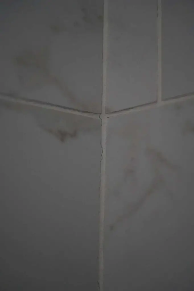 Prior to the demo, we noticed further up the shower wall that there were more cracks in the grout, which was symptomatic of the poor workmanship on our bathroom remodel