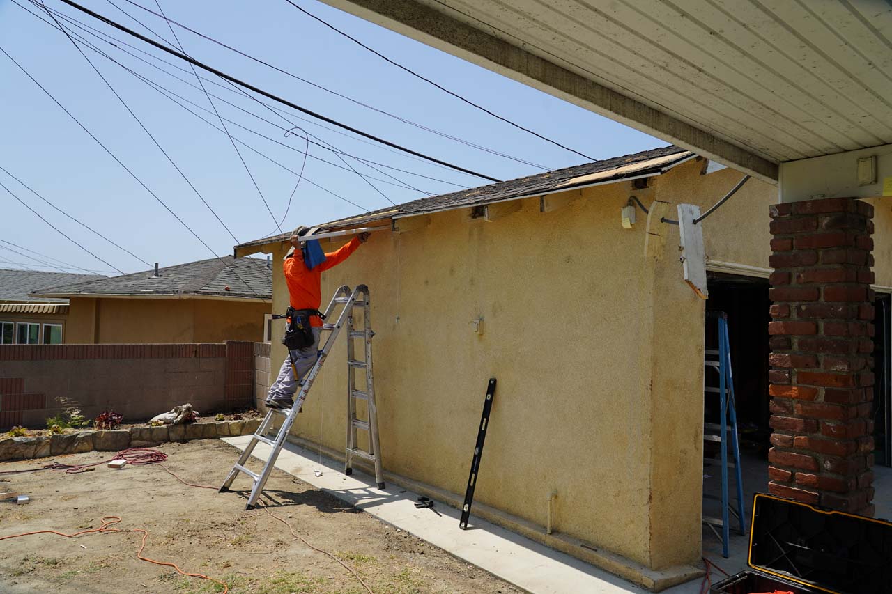 Sky Net Termite doing repairs on a damaged part of the garage