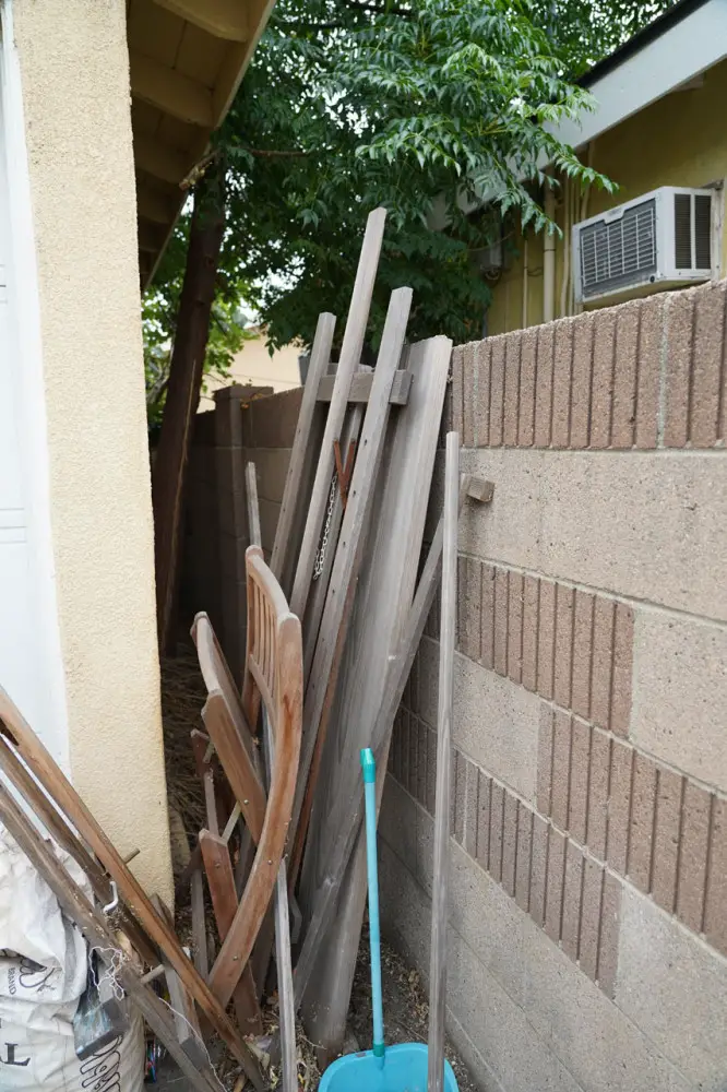 We had tenants that practically invited termites to our home by storing raw wood next to the house like this