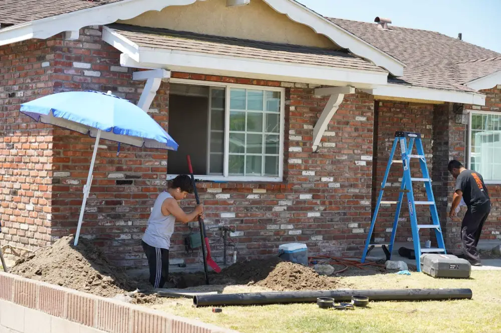 Work being done to dig down to the main sewer line and insert a cleanout